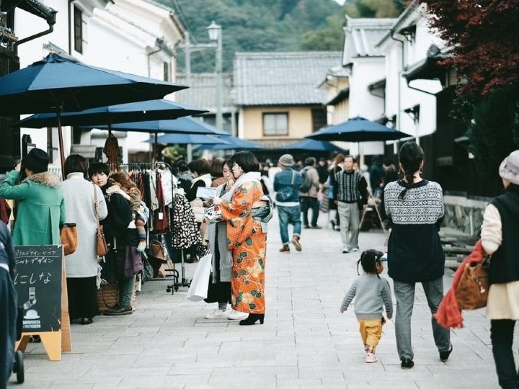 People walking through Ozu's traditional streets